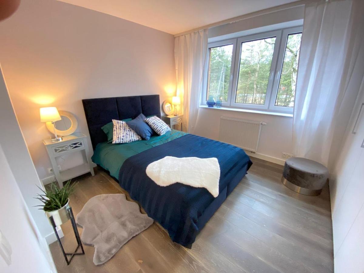 Apartment Luksusowa Pod Lasem, - Shared Garden, Sauna, Wood Hot Tub! Hot Tub Seasonal! Otwock